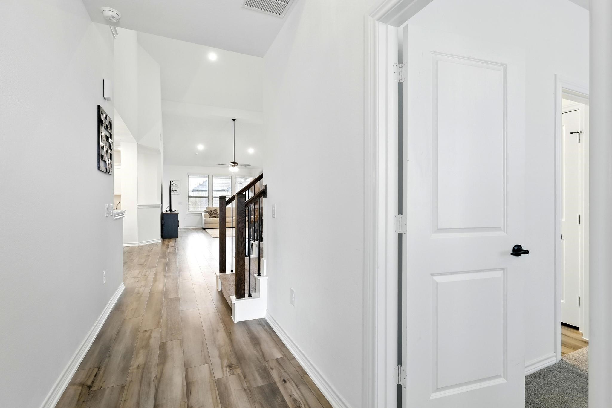 15727 Rosemary Hl Lane Conroe, TX 77302 - Photo 13 of 28 a view of hallway with wooden floor