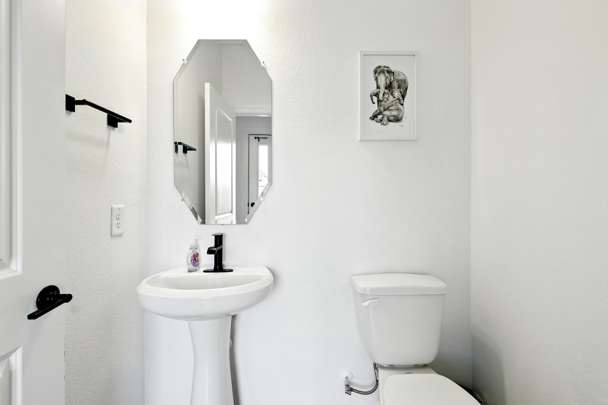 15727 Rosemary Hl Lane Conroe, TX 77302 - Photo 18 of 28 a bathroom with a toilet sink and mirror