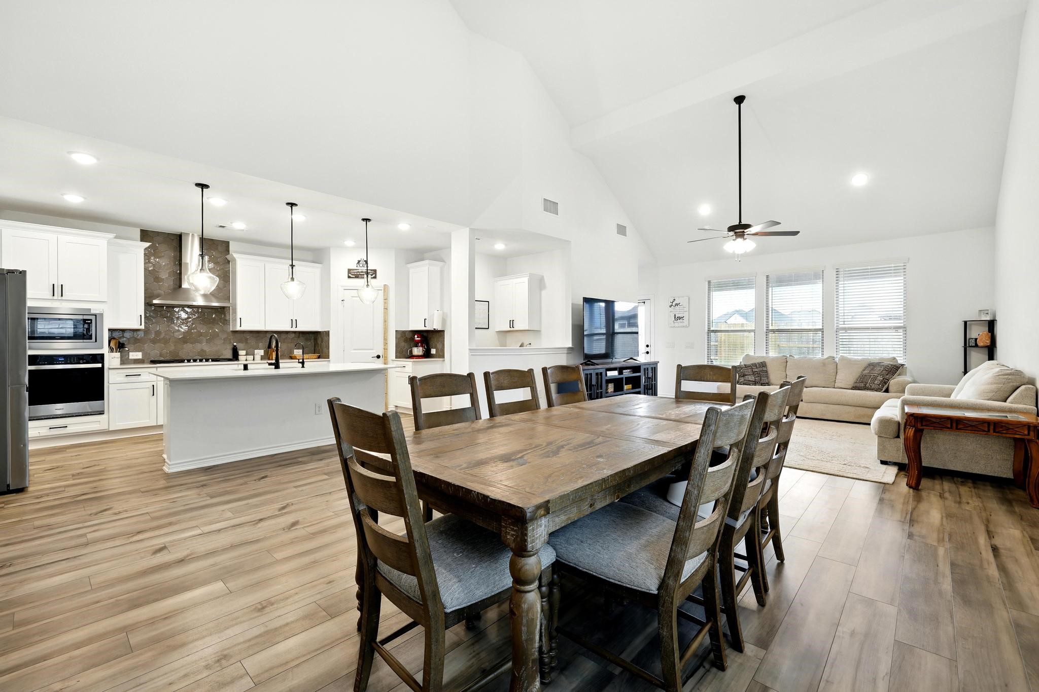15727 Rosemary Hl Lane Conroe, TX 77302 - Photo 2 of 28 a view of a dining area with furniture and wooden floor