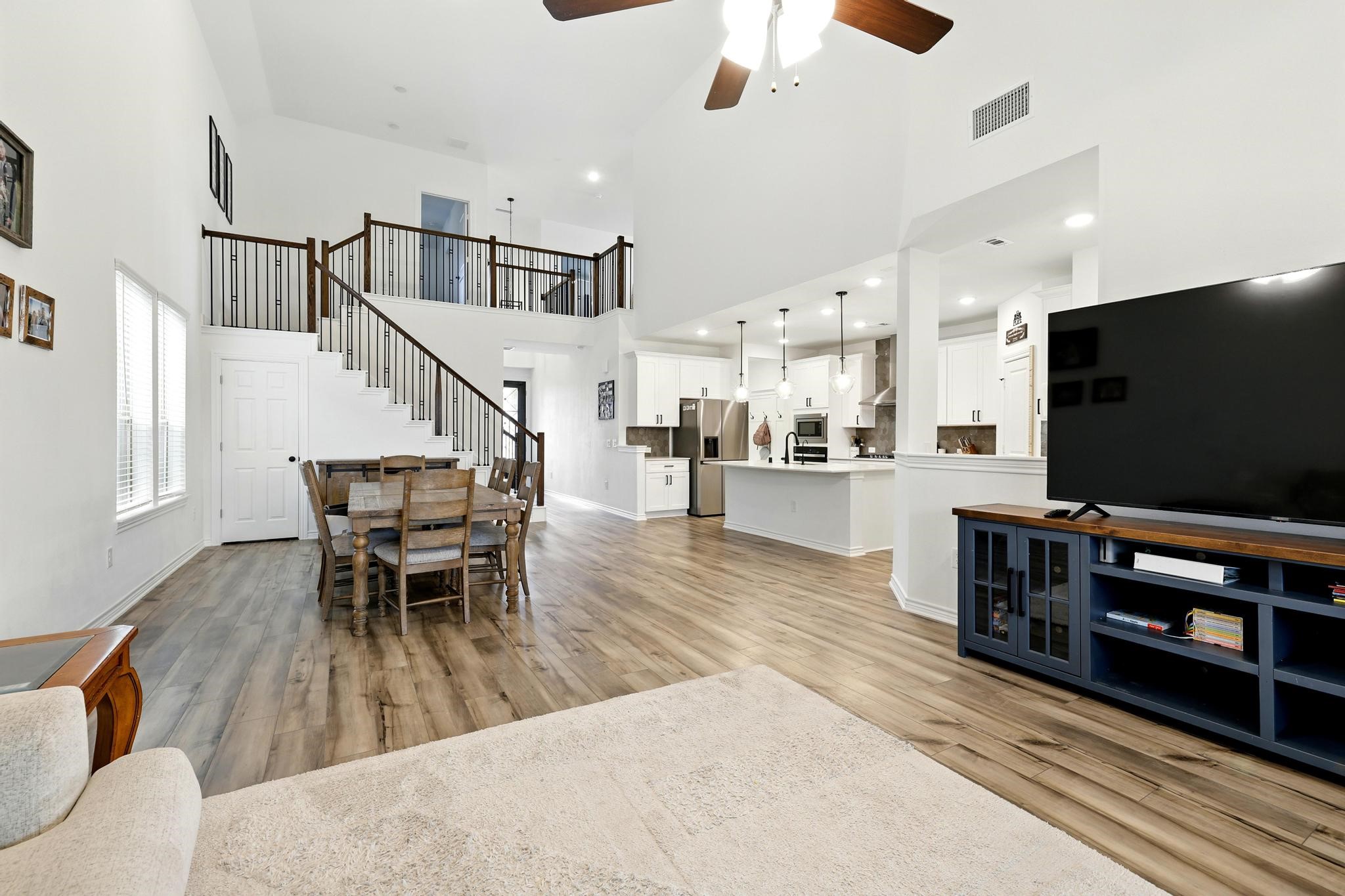 15727 Rosemary Hl Lane Conroe, TX 77302 - Photo 3 of 28 a living room with furniture and a flat screen tv