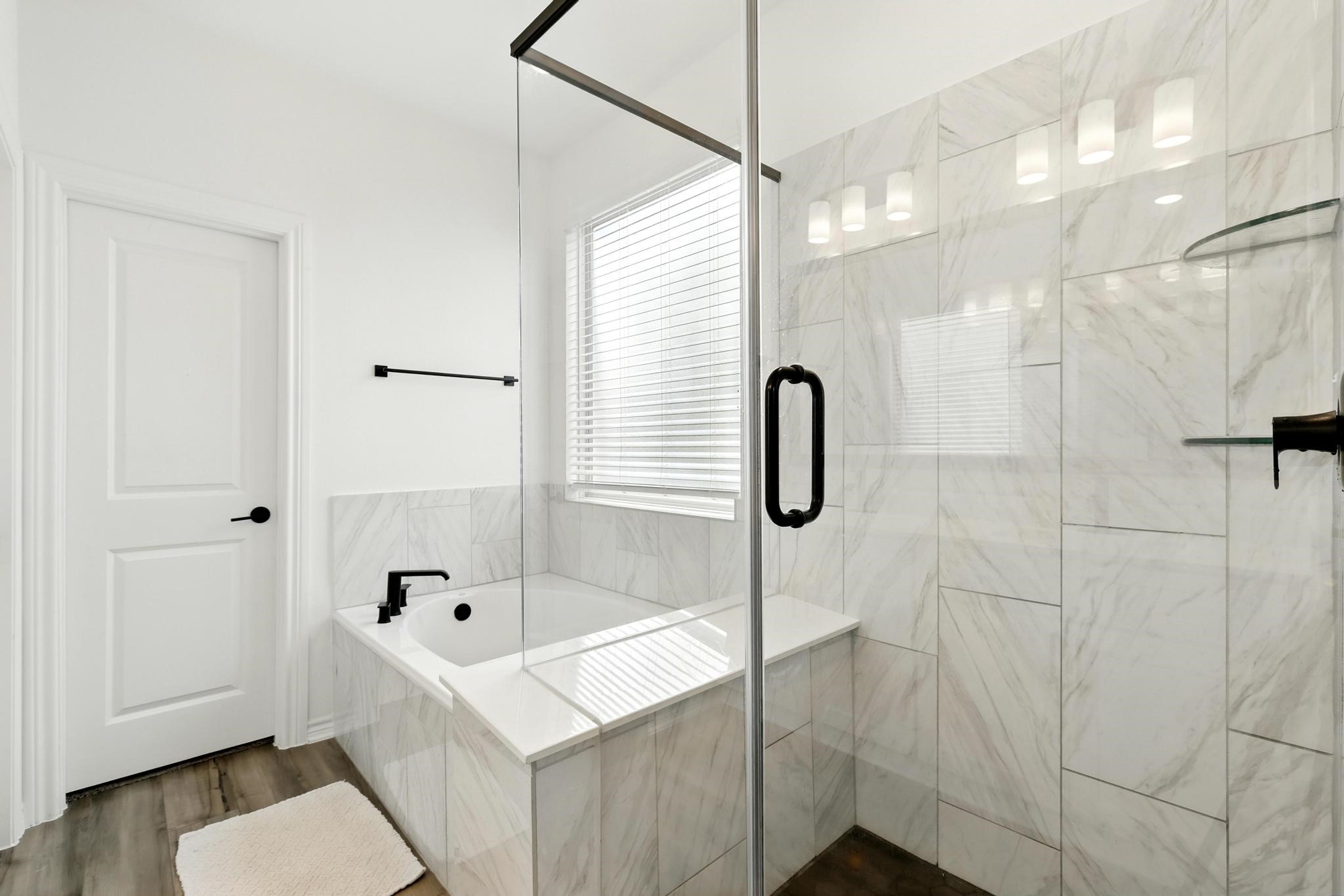 15727 Rosemary Hl Lane Conroe, TX 77302 - Photo 10 of 28 a bathroom with a sink a toilet and shower