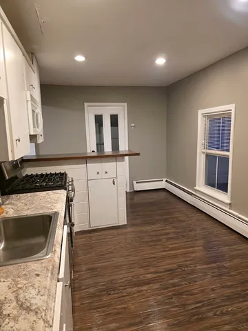 a bathroom with a sink and mirror