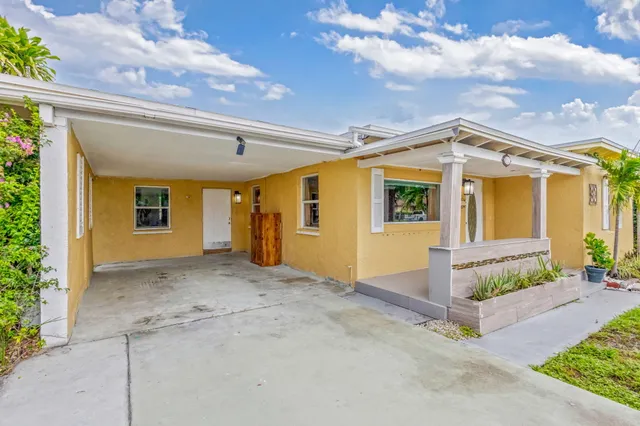 a view of a patio with couches and potted plants