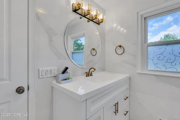 a bathroom with a sink and a mirror