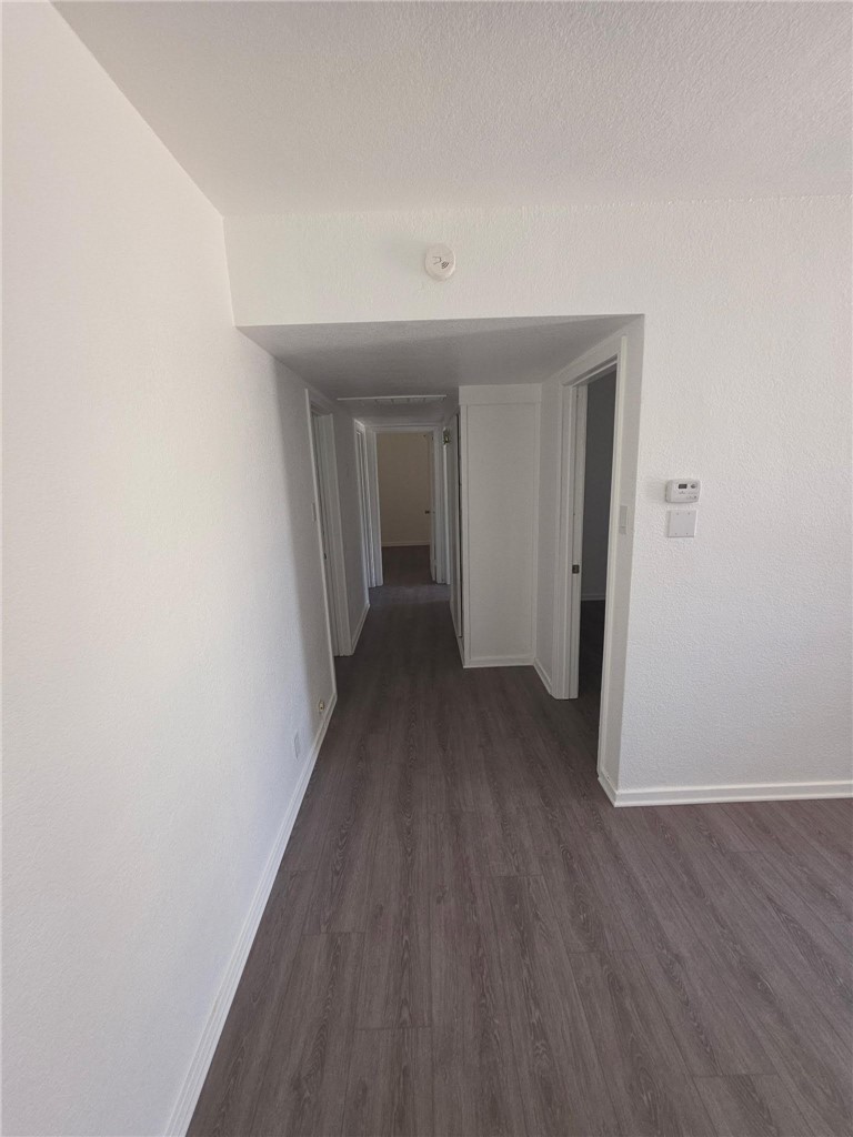 512 E Street Needles, CA 92363 - Photo 16 of 20 a view of a hallway with wooden floor