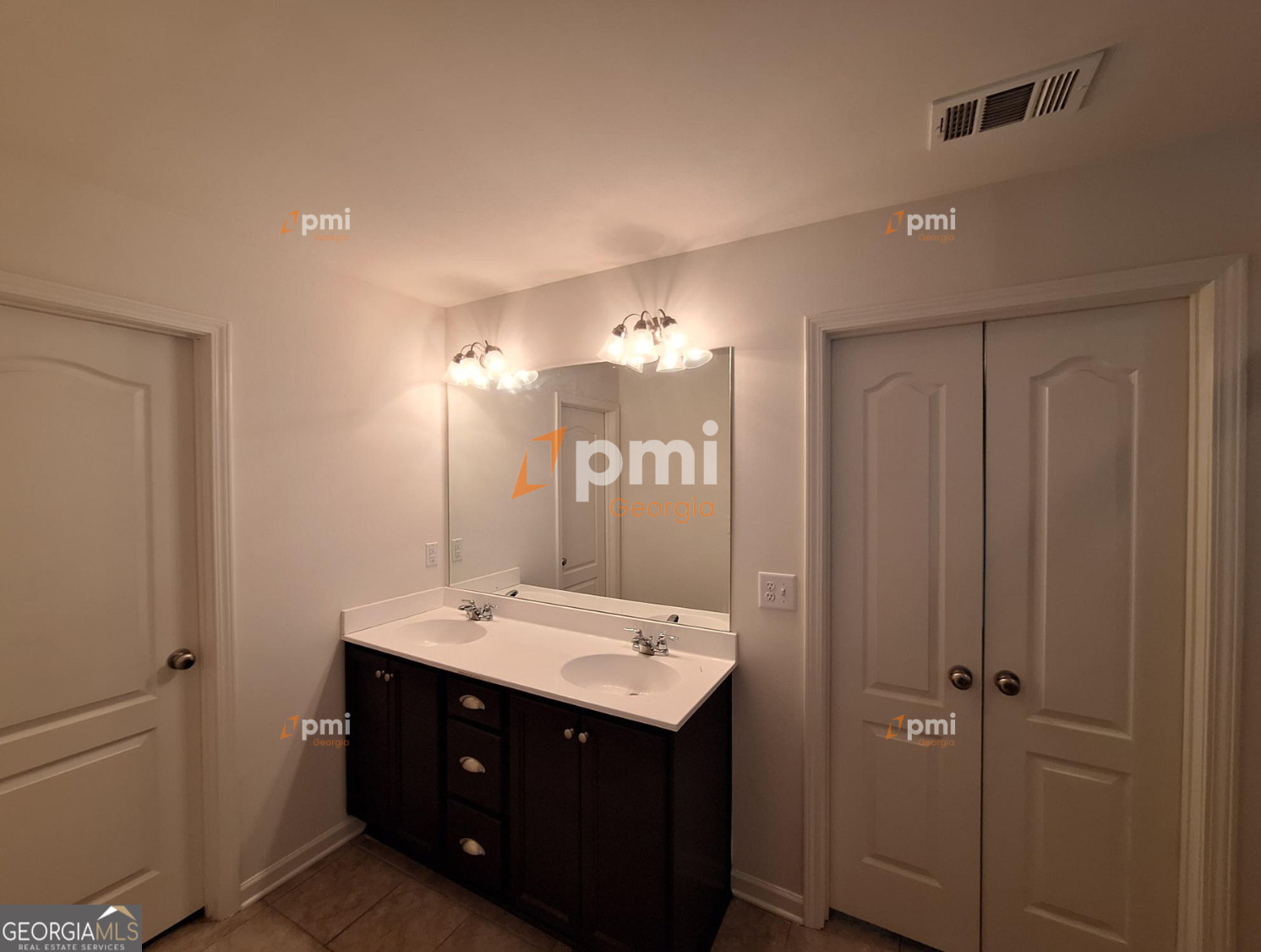 7598 Bucknell Terrace Fairburn, GA 30213 - Photo 11 of 19 a bathroom with a sink vanity and mirror