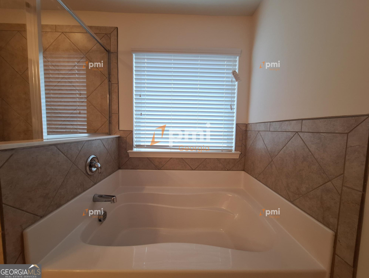 7598 Bucknell Terrace Fairburn, GA 30213 - Photo 12 of 19 a bathroom with a bathtub