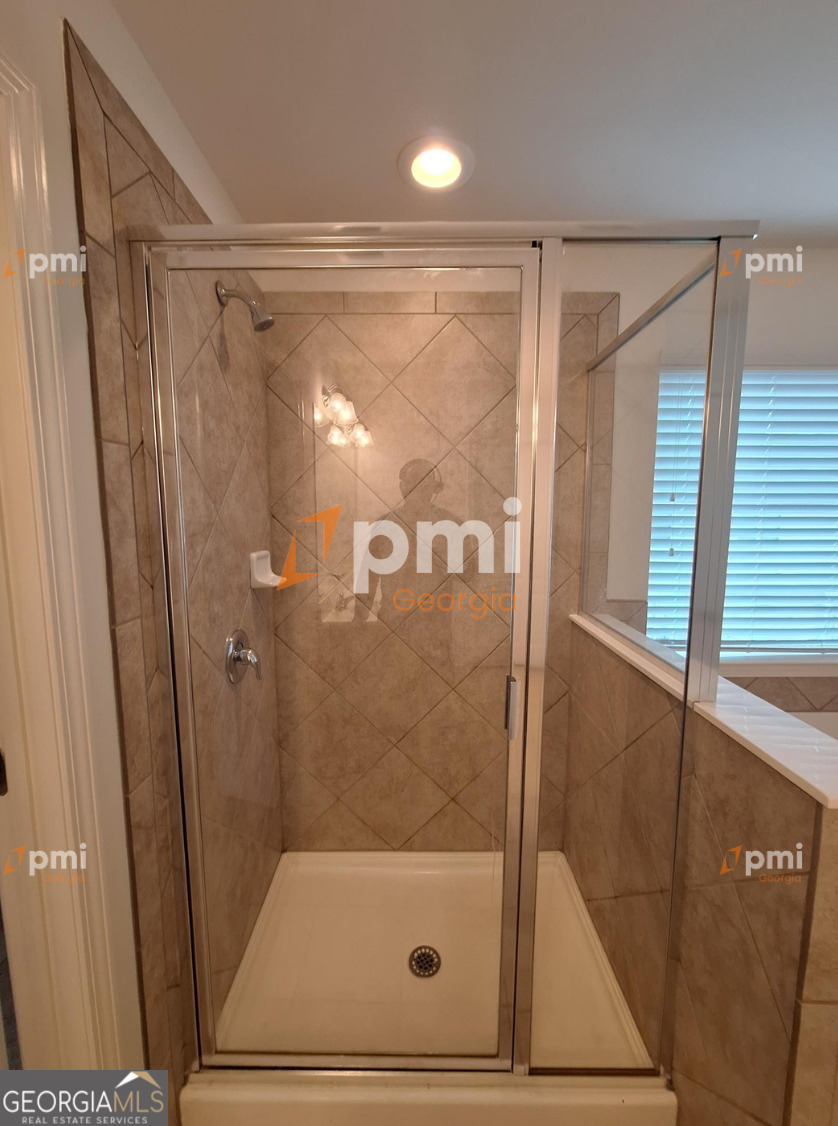 7598 Bucknell Terrace Fairburn, GA 30213 - Photo 13 of 19 a bathroom with a shower