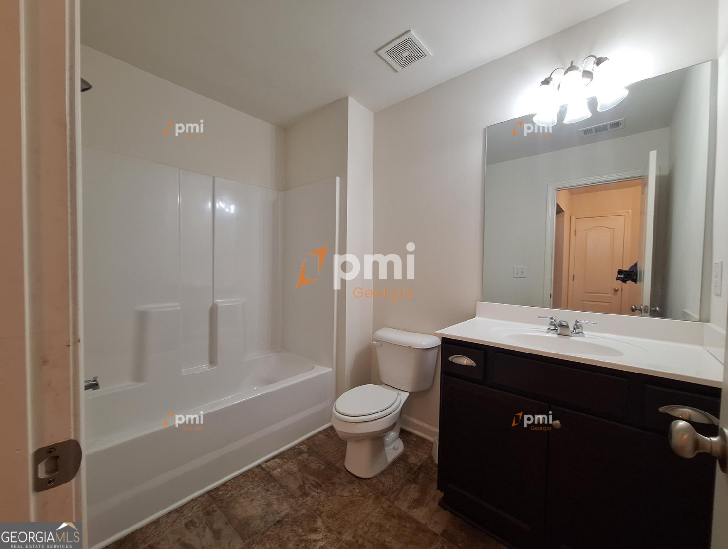7598 Bucknell Terrace Fairburn, GA 30213 - Photo 14 of 19 a bathroom with a sink a toilet a mirror and shower