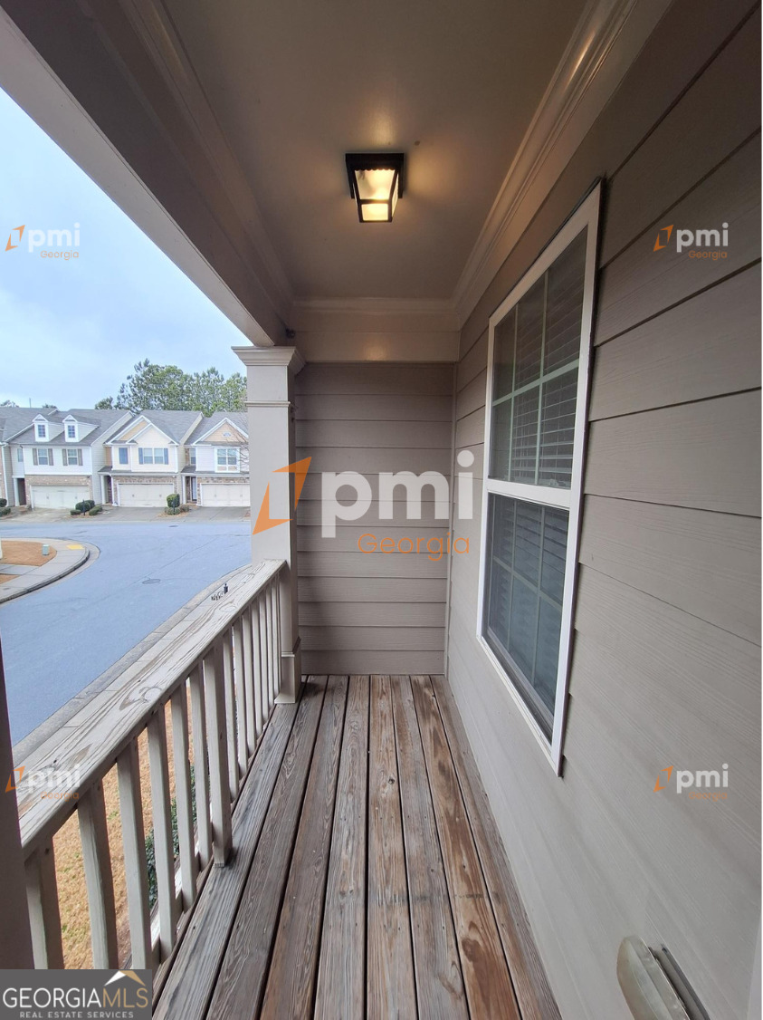 7598 Bucknell Terrace Fairburn, GA 30213 - Photo 18 of 19 a view of a balcony with wooden floor