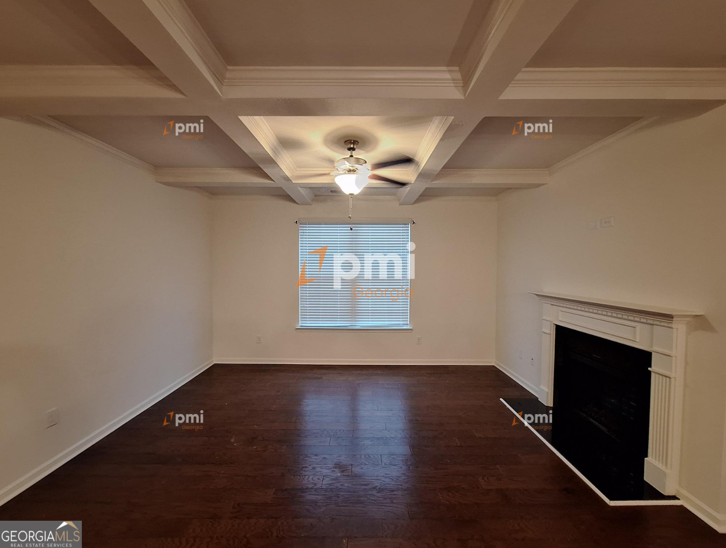 7598 Bucknell Terrace Fairburn, GA 30213 - Photo 4 of 19 a view of an empty room with wooden floor and a window