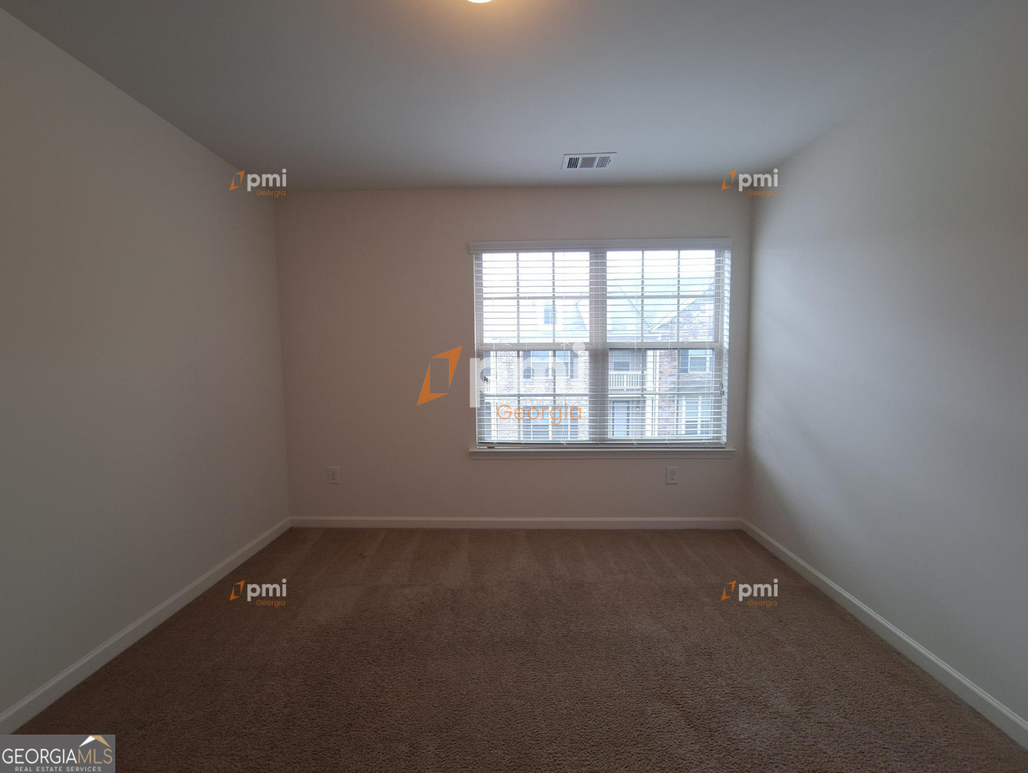 7598 Bucknell Terrace Fairburn, GA 30213 - Photo 6 of 19 an empty room with a window