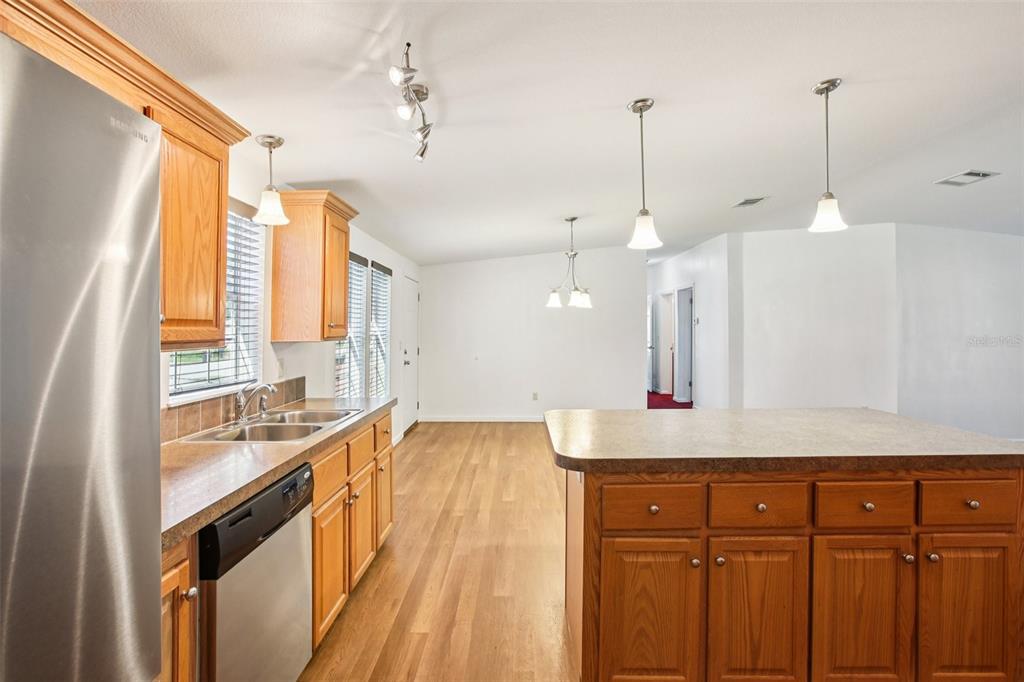 12373 Tree Street Largo, FL 33773 - Photo 12 of 43 a view of a kitchen with a sink and wooden floor