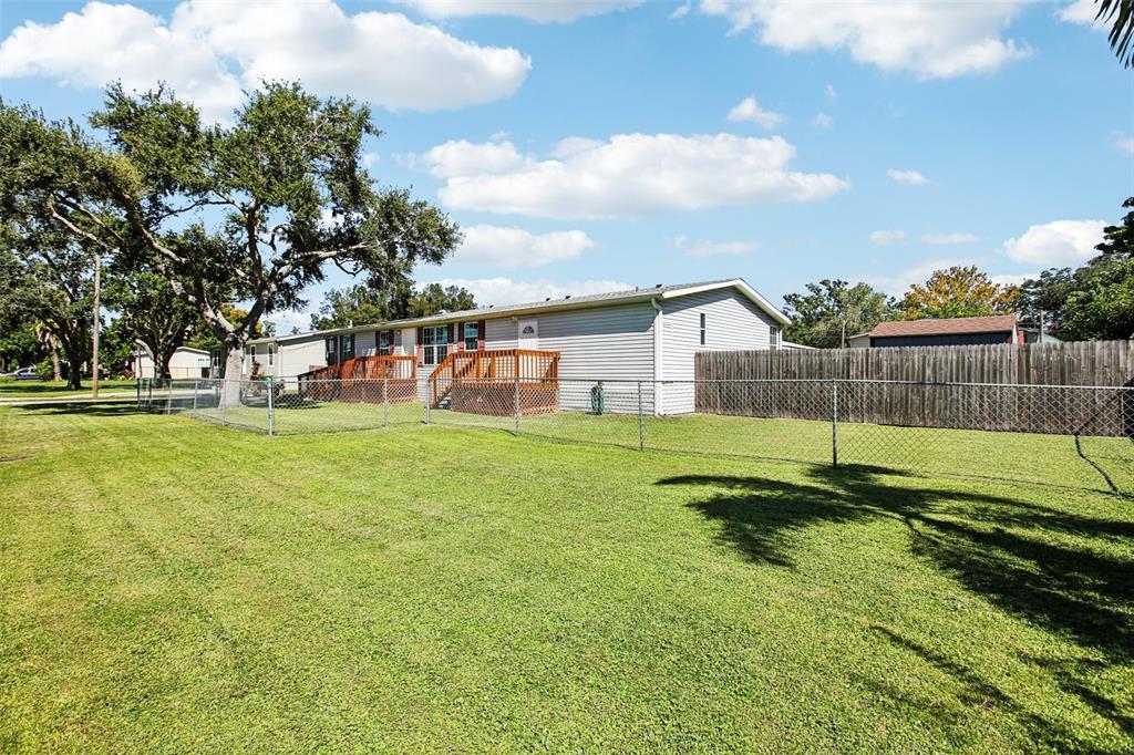 12373 Tree Street Largo, FL 33773 - Photo 2 of 43 a view of a house with a yard and sitting area