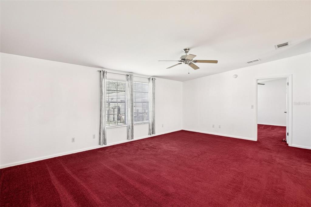 12373 Tree Street Largo, FL 33773 - Photo 21 of 43 wooden floor in an empty room with a window
