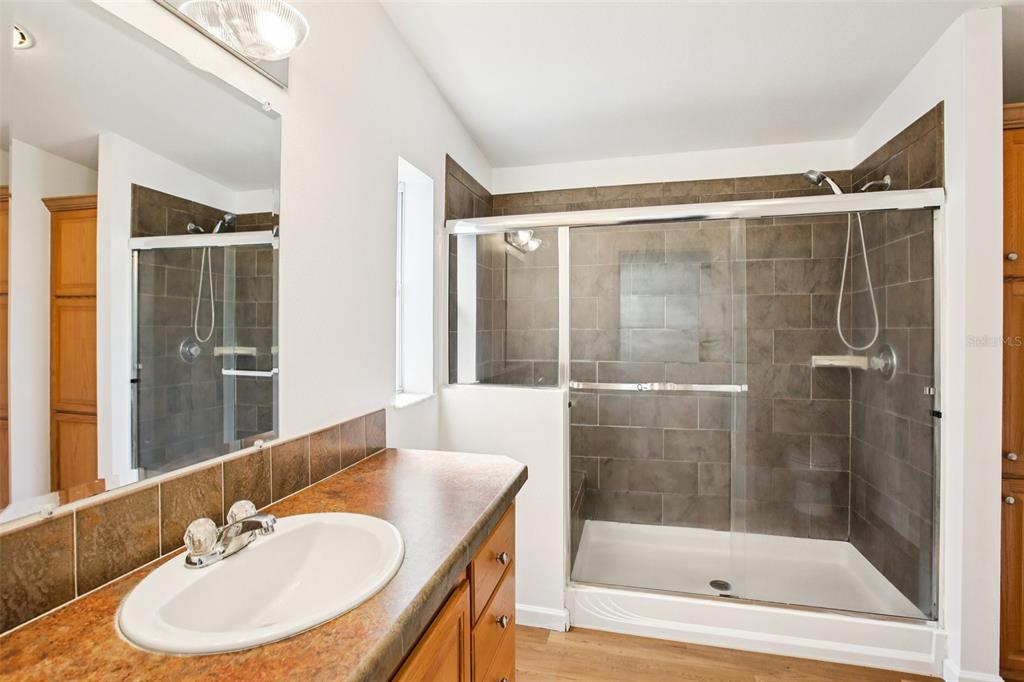 12373 Tree Street Largo, FL 33773 - Photo 23 of 43 a bathroom with a sink and a mirror