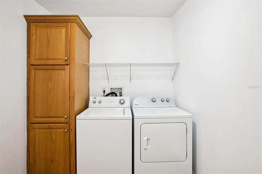 12373 Tree Street Largo, FL 33773 - Photo 31 of 43 a utility room with dryer and washer