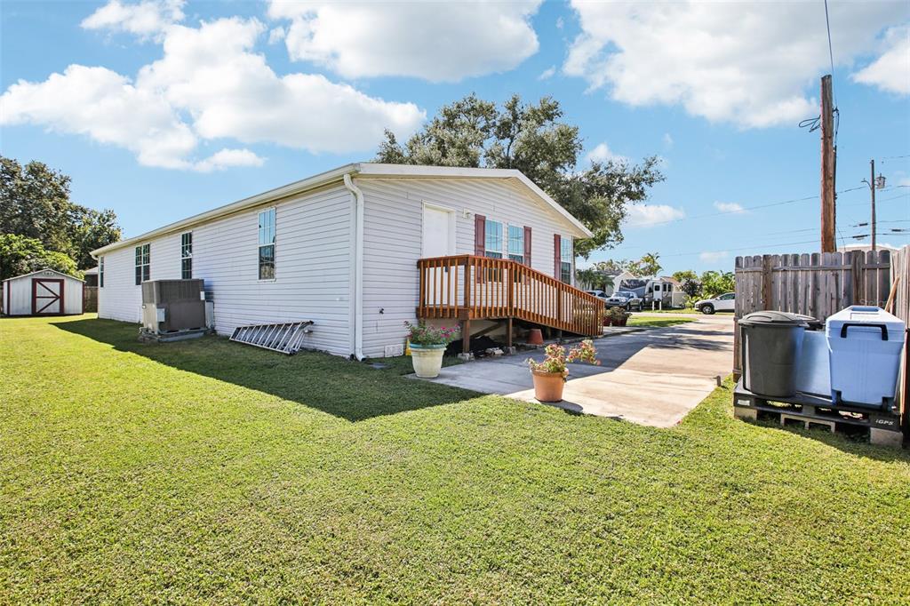 12373 Tree Street Largo, FL 33773 - Photo 33 of 43 a view of a house with backyard and sitting area