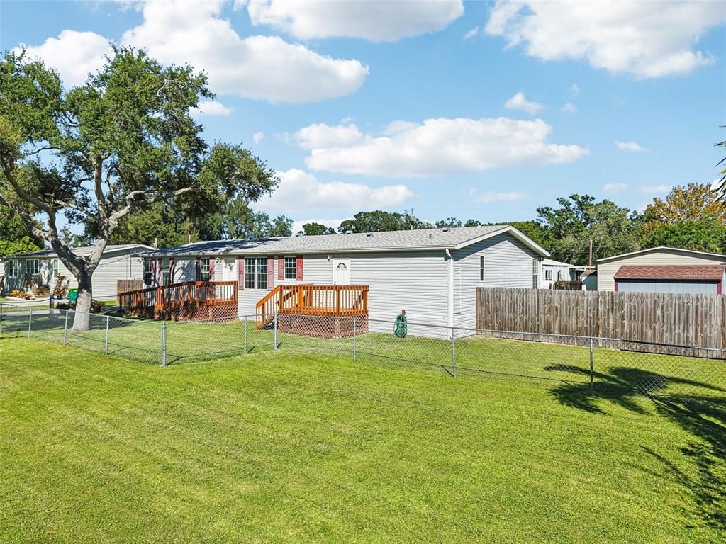 12373 Tree Street Largo, FL 33773 - Photo 37 of 43 a view of a house with a yard
