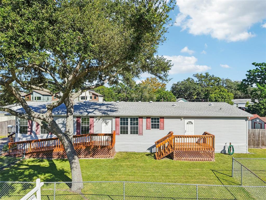 12373 Tree Street Largo, FL 33773 - Photo 38 of 43 a view of a house with backyard porch and sitting area