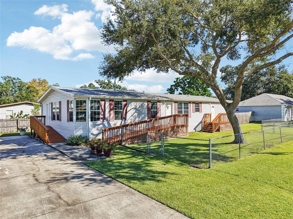 12373 Tree Street Largo, FL 33773 - Photo 39 of 43 a view of an house with backyard and a tree
