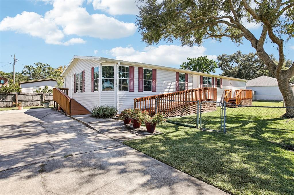 12373 Tree Street Largo, FL 33773 - Photo 4 of 43 a view of a house with backyard and sitting area