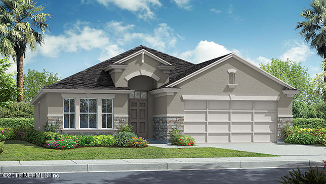 697 Deer Crossing Road St. Augustine, FL 32086 - Photo 1 of 4 a front view of a house with a garden