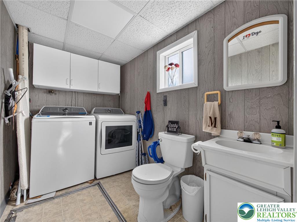 2628 Levans Road Coplay, PA 18037 - Photo 26 of 54 Functional utility room featuring integrated laundry appliances and a convenient half bath.