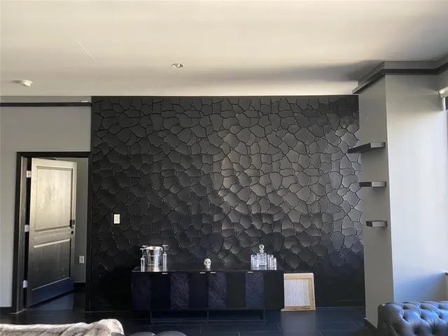 a kitchen with stainless steel appliances granite countertop a refrigerator a stove and a wooden floors