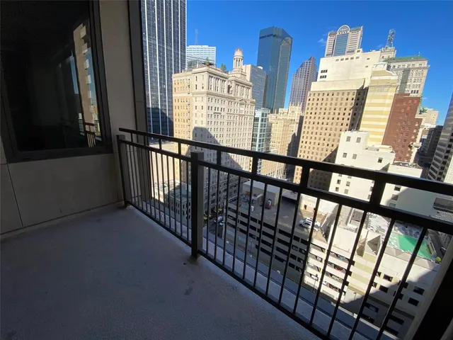a kitchen with granite countertop kitchen island stainless steel appliances a sink and counter space
