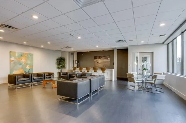 a group of chairs sitting in backyard of house