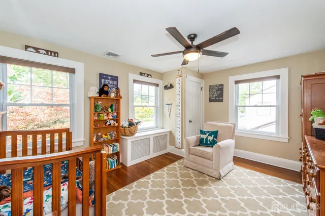 a living room with furniture and windows