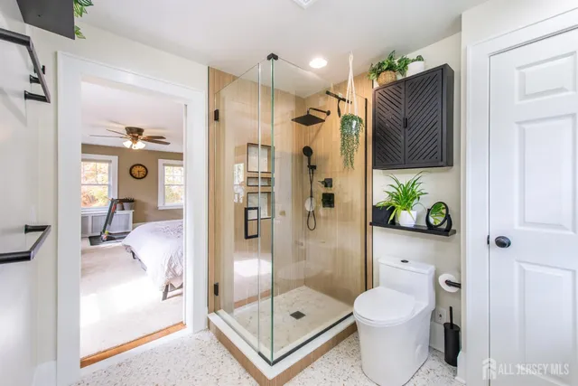 a bathroom with a glass shower door
