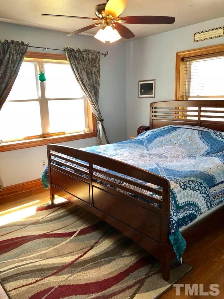 41 Anderson Jones Road Roxboro, NC 27574 - Photo 13 of 25 a bedroom with a bed and a window