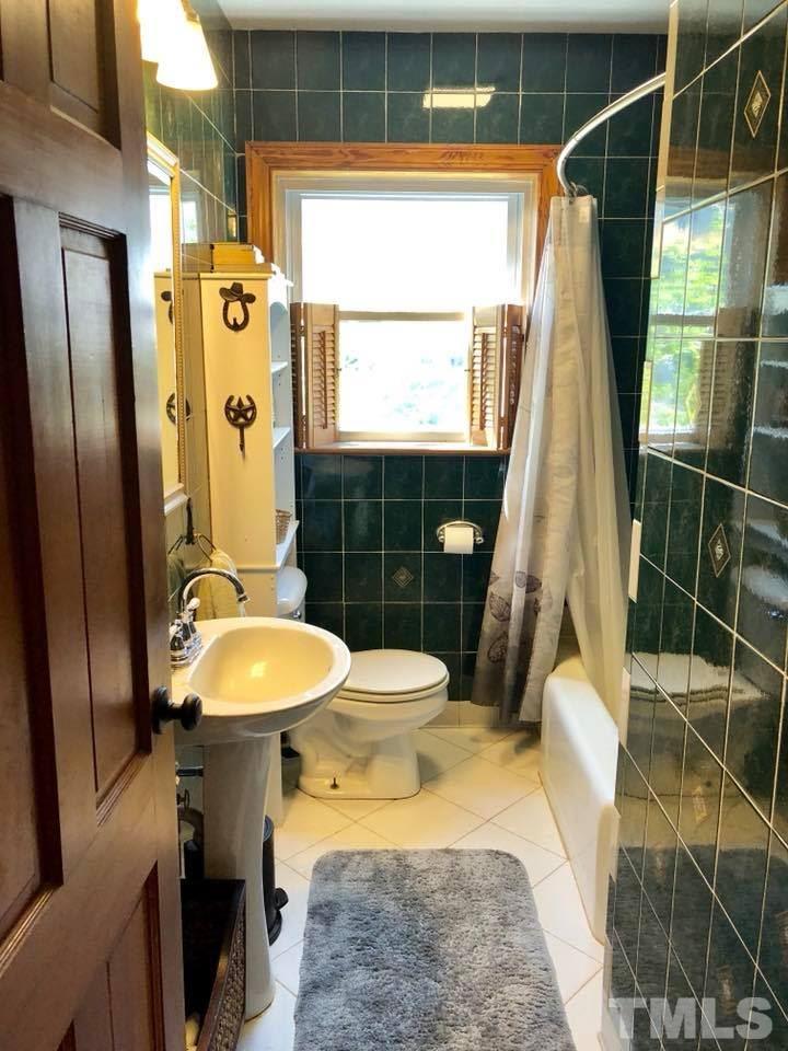 41 Anderson Jones Road Roxboro, NC 27574 - Photo 14 of 25 a bathroom with a sink toilet and shower