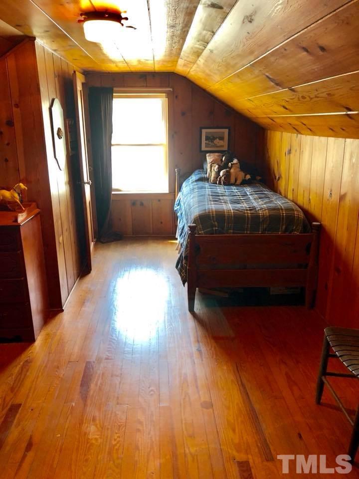 41 Anderson Jones Road Roxboro, NC 27574 - Photo 17 of 25 a bedroom with a bed and a window