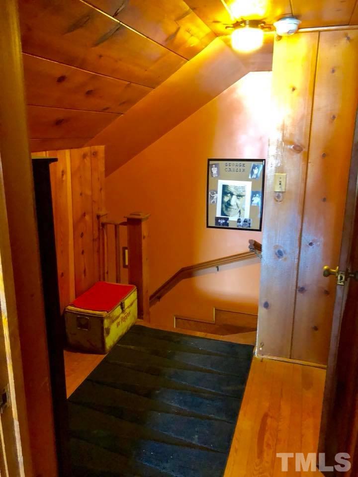 41 Anderson Jones Road Roxboro, NC 27574 - Photo 22 of 25 a bedroom with a bed and a mirror