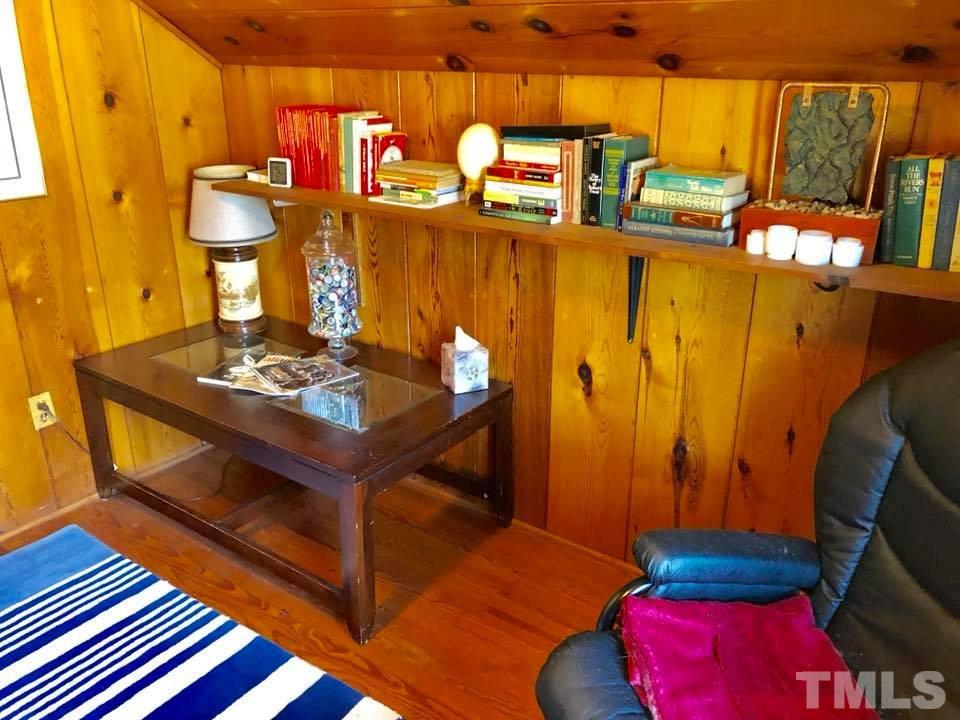 41 Anderson Jones Road Roxboro, NC 27574 - Photo 24 of 25 a living room with blue lights with furniture