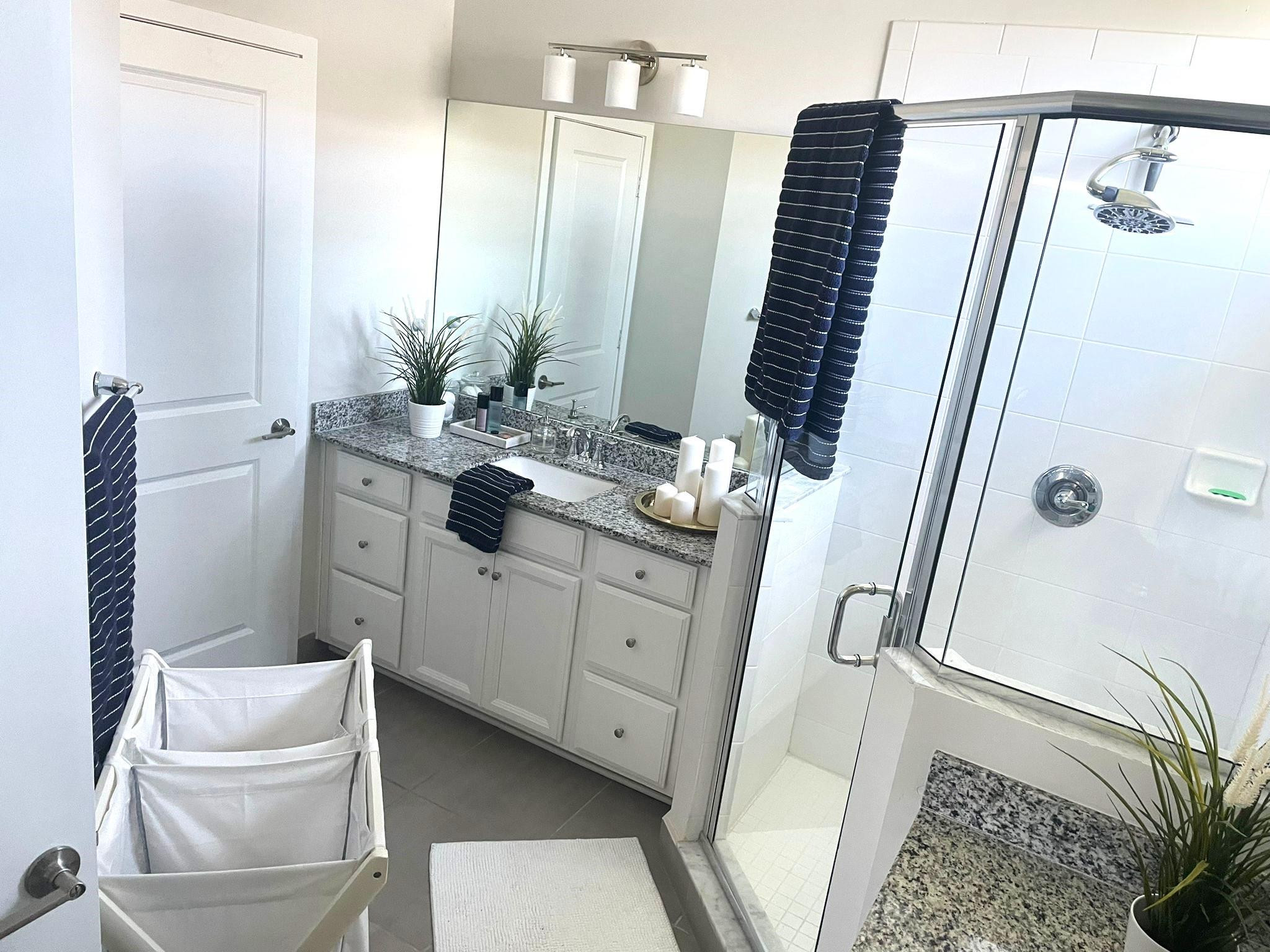 10957 Southwest 232nd Terrace Homestead, FL 33032 - Photo 8 of 11 a bathroom with a sink a mirror and a shower