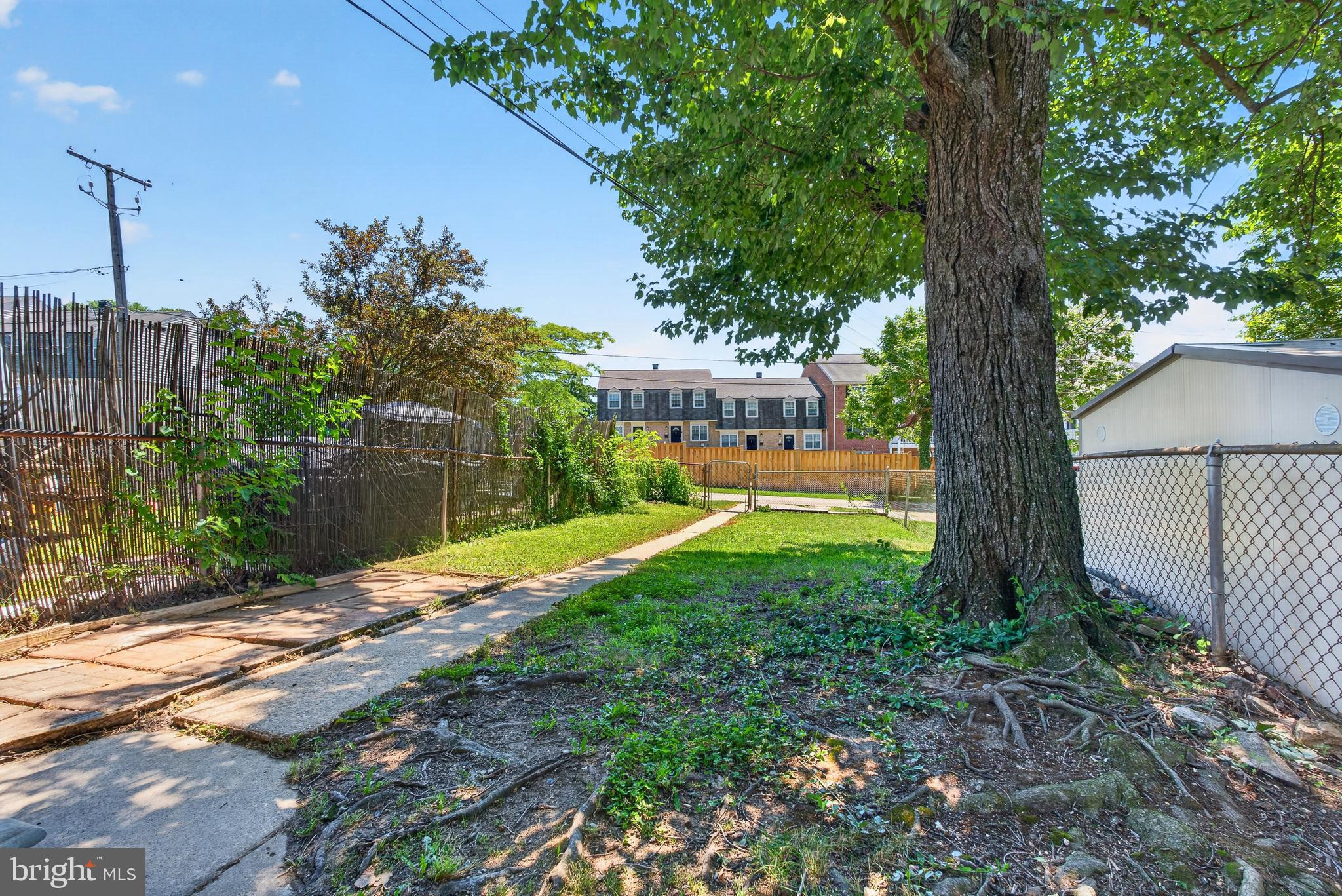 2115 Pitney Road Baltimore, MD 21234 - Photo 26 of 29 Rear yard with concrete walkway to parking pad