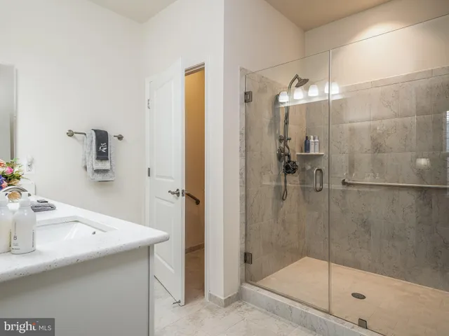 a bathroom with a sink a mirror and a window