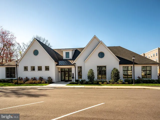a view of a patio with table and chairs with wooden floor and fence