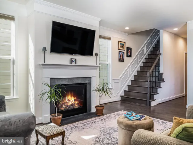 a view of a dining room with furniture wooden floor and a chandelier