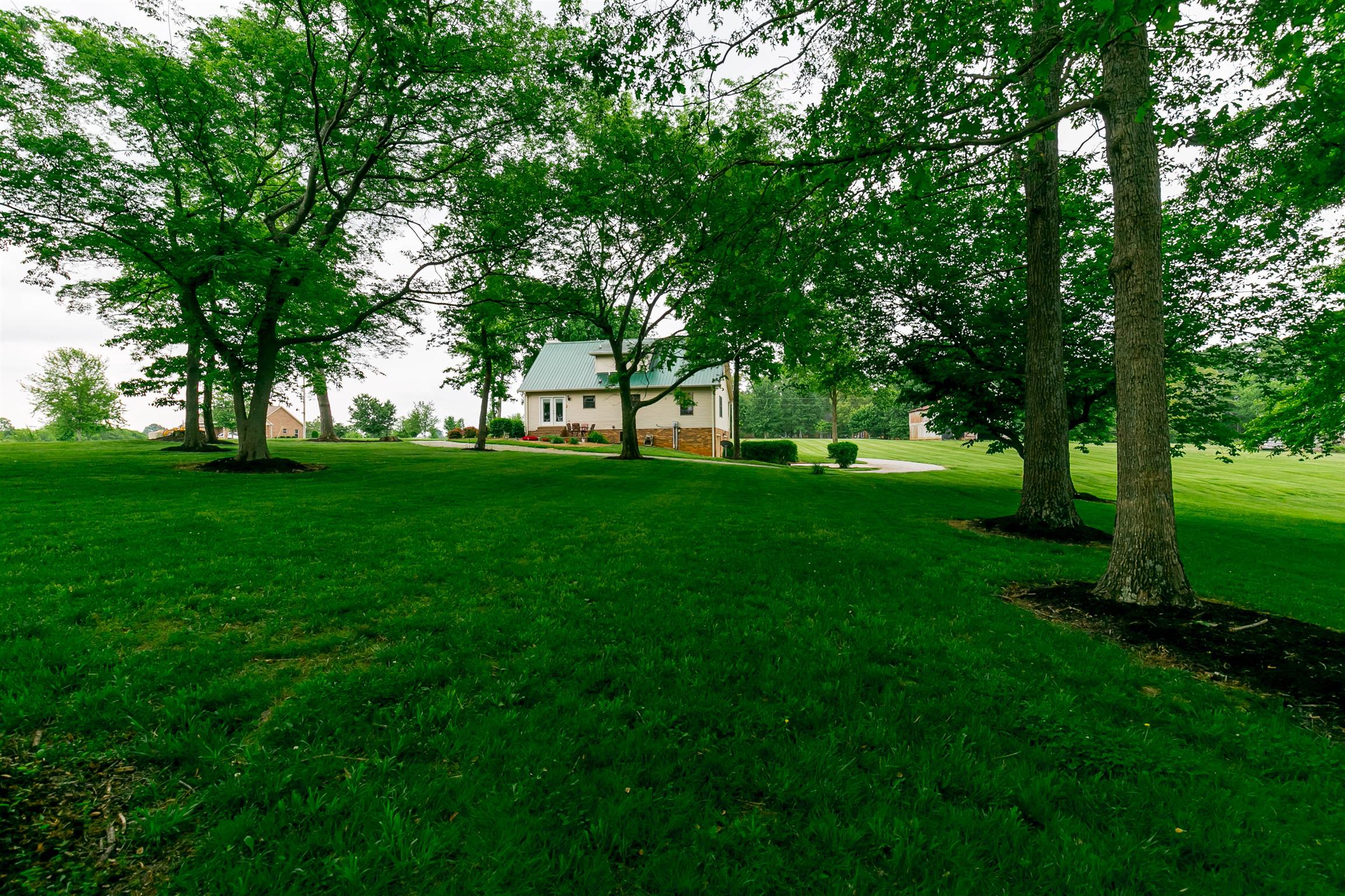 4570 Barren Plains Road Springfield, TN 37172 - Photo 6 of 26 a view of grassy field with benches