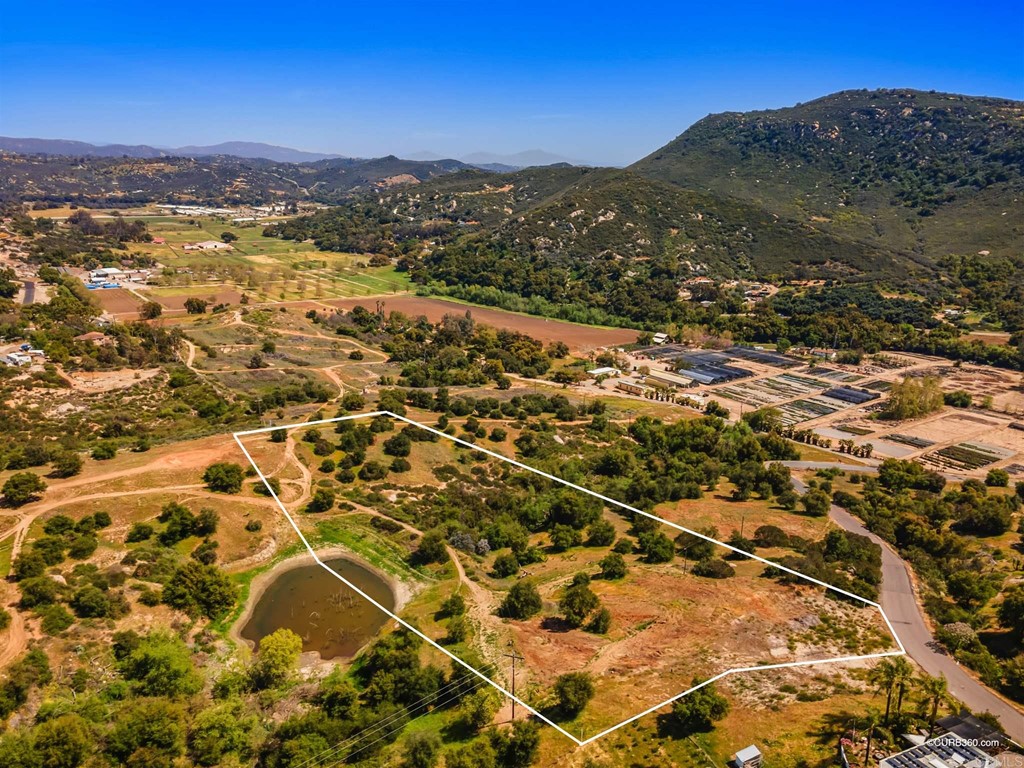 27209 Cool Water Ranch Road Valley Center, CA 92082 - Photo 1 of 1 an aerial view of residential houses with outdoor space