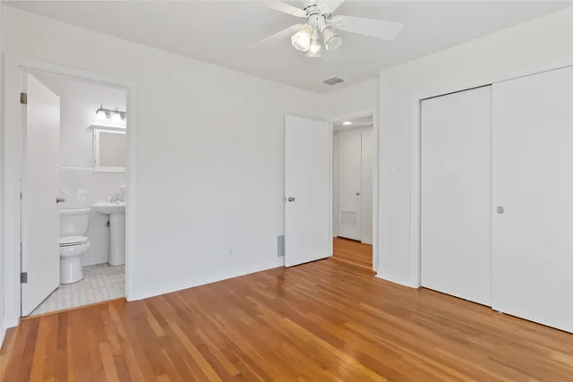 a bathroom with a sink toilet and a mirror