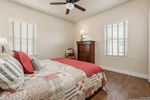 a bedroom with a bed dresser and a window