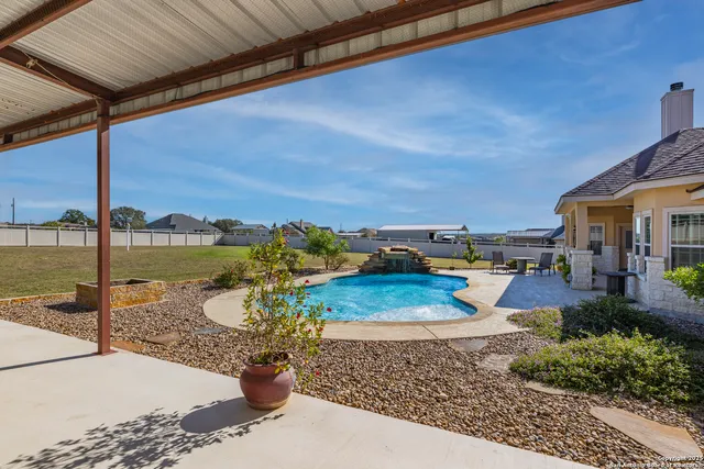 a view of a patio with a table chairs and a patio