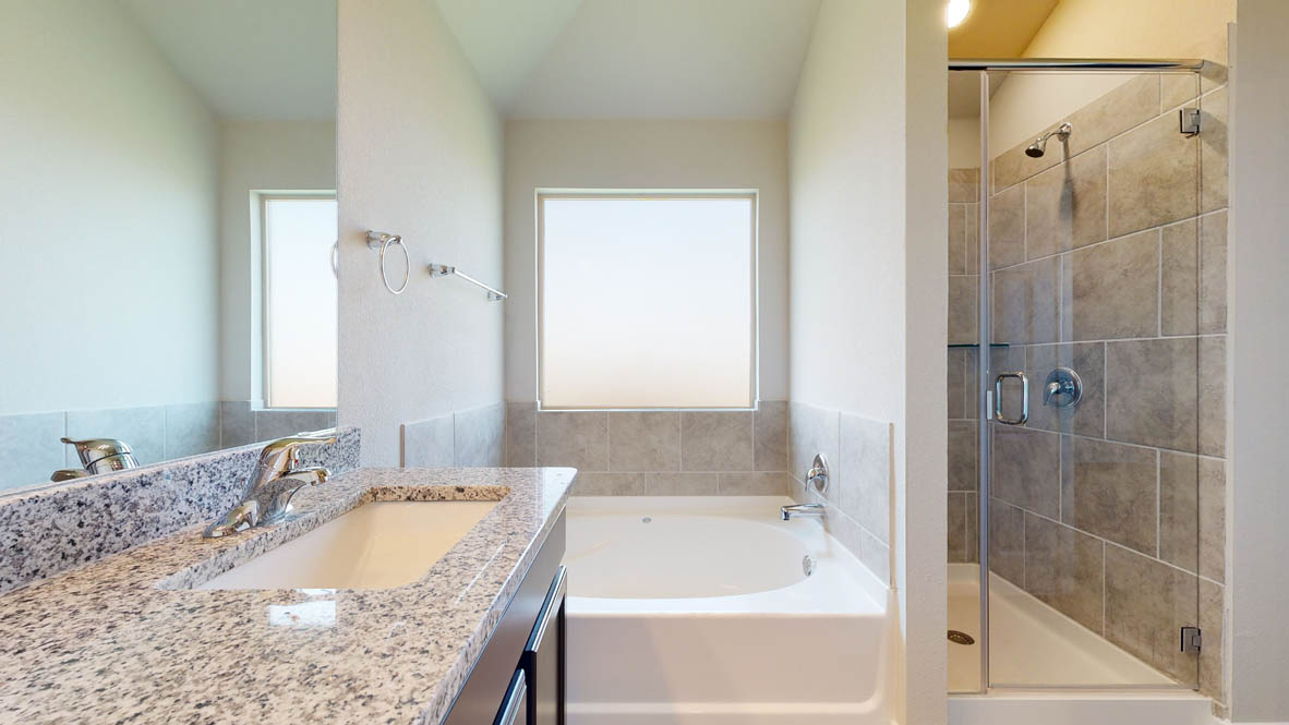 104 Kenzie Street Thorndale, TX 76577 - Photo 16 of 28 a bathroom with a granite countertop tub sink and shower