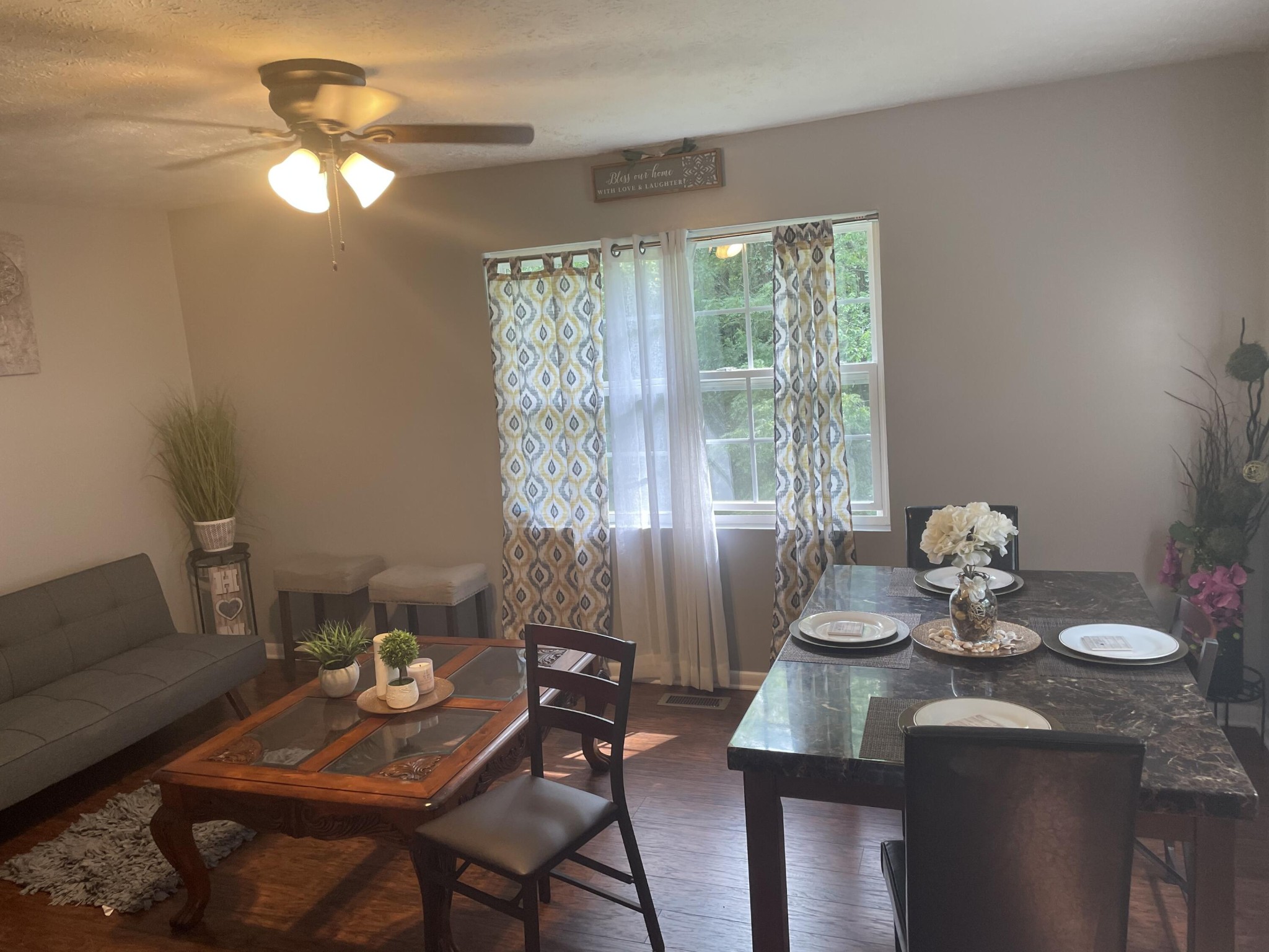 107109 Hunter Place Oak Ridge, TN 37830 - Photo 7 of 9 a dining room with furniture and a chandelier